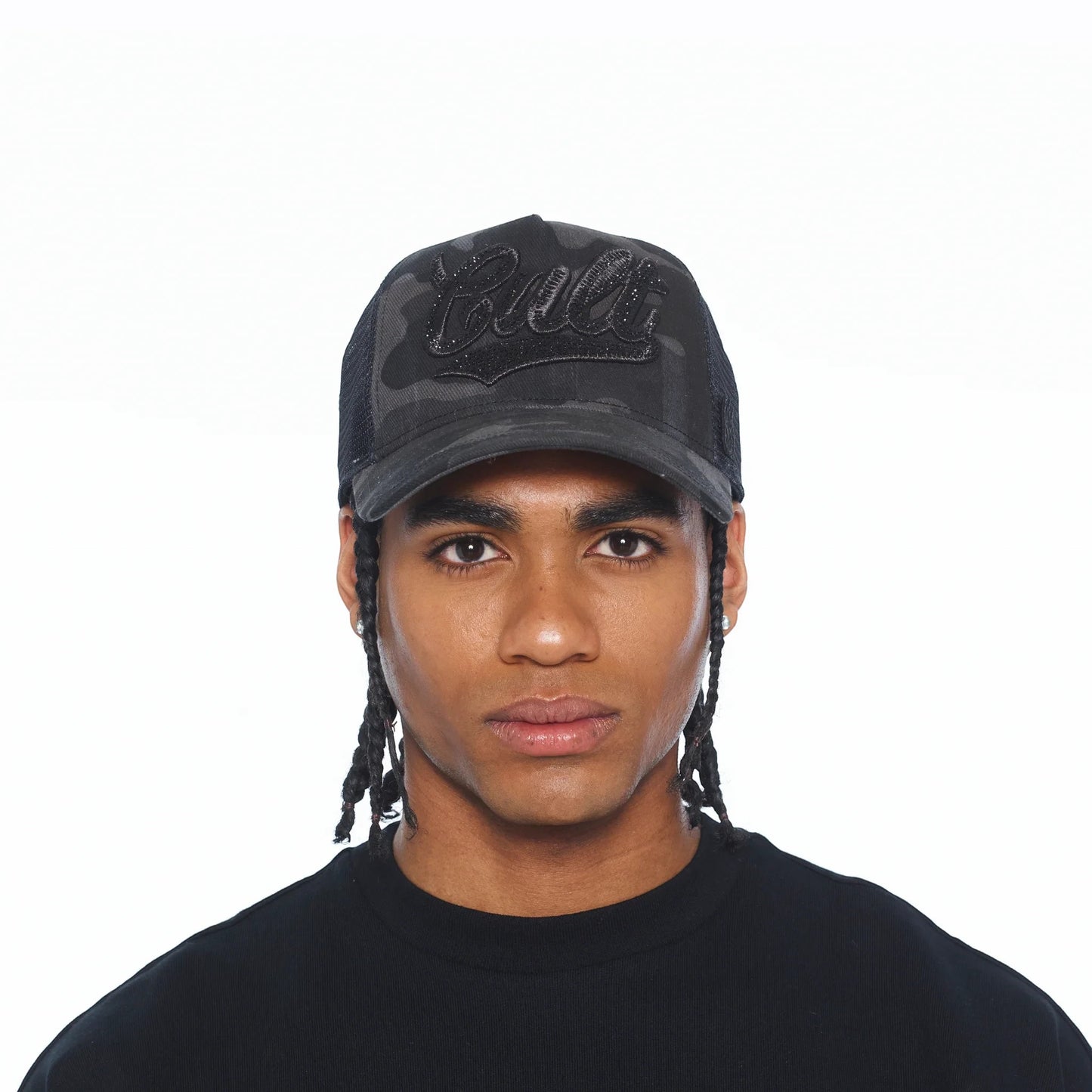 Ballers Clothing Shop camo mesh back trucker hat with black crystal script logo worn by a man