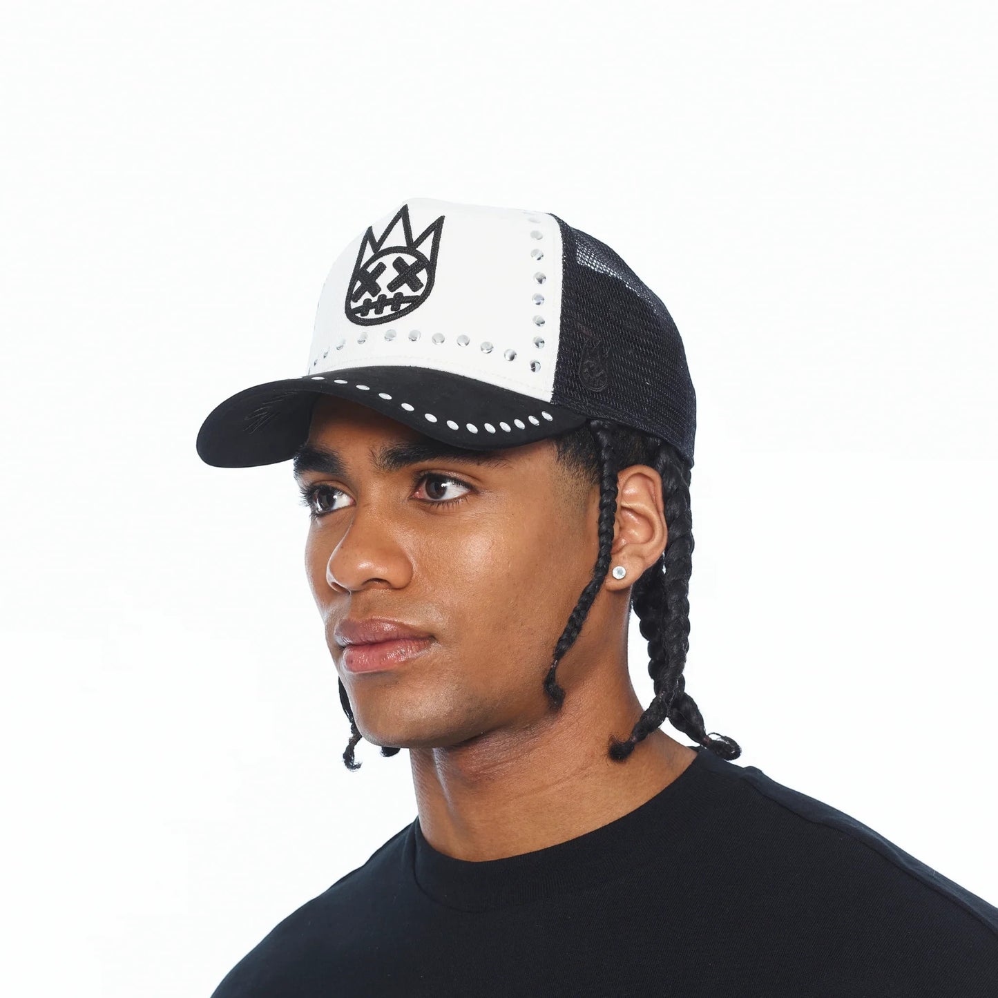 Ballers Clothing Shop black and white mesh trucker hat with embroidered logo and stud detailing on a male model