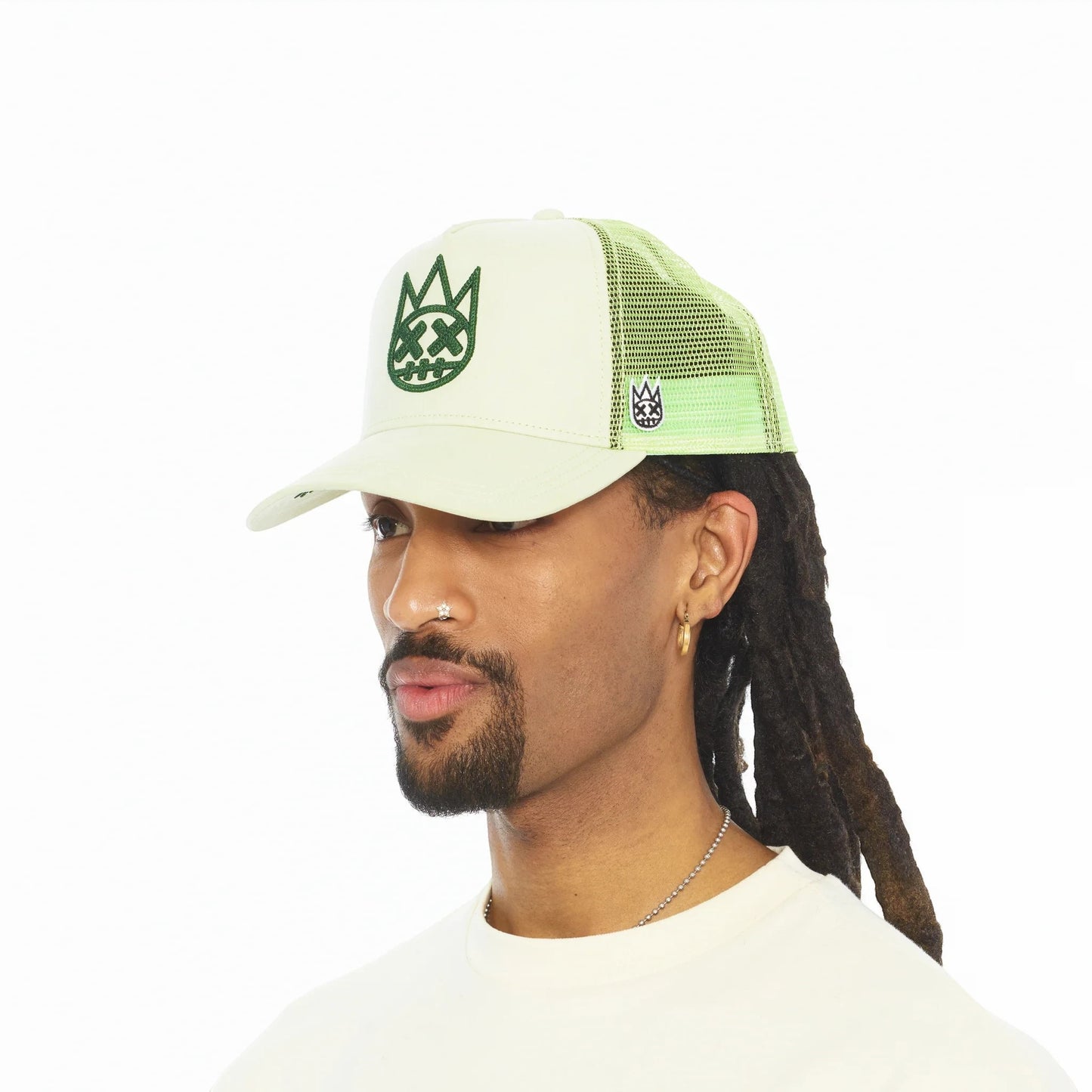 Ballers Clothing Shop seafoam green suede trucker hat with mesh back and raised chain-stitch logo on a male model