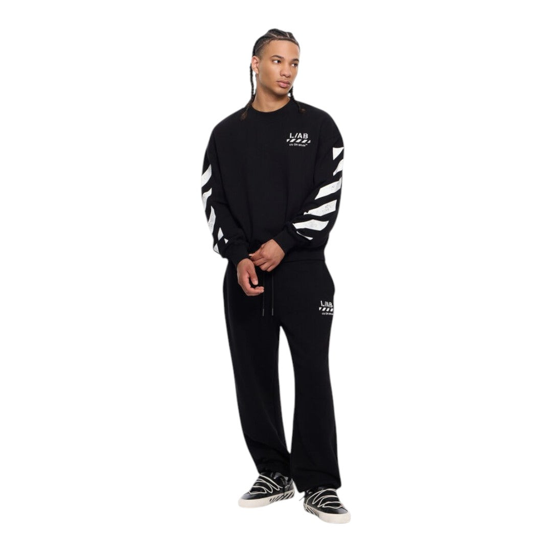 Model wearing Ballers Clothing Shop L/AB c/o Off-White black cotton crewneck sweater with white sleeve diagonal print