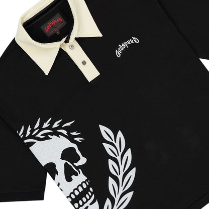 Ballers Clothing Shop black polo shirt with cream collar, skull and laurel wreath graphic, and Godspeed logo.