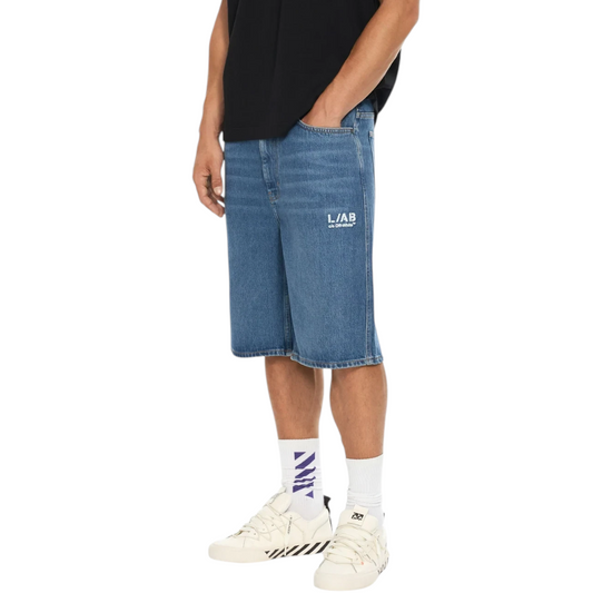 Ballers Clothing Shop L/AB c/o Off-White blue denim shorts with white logo print worn by a model