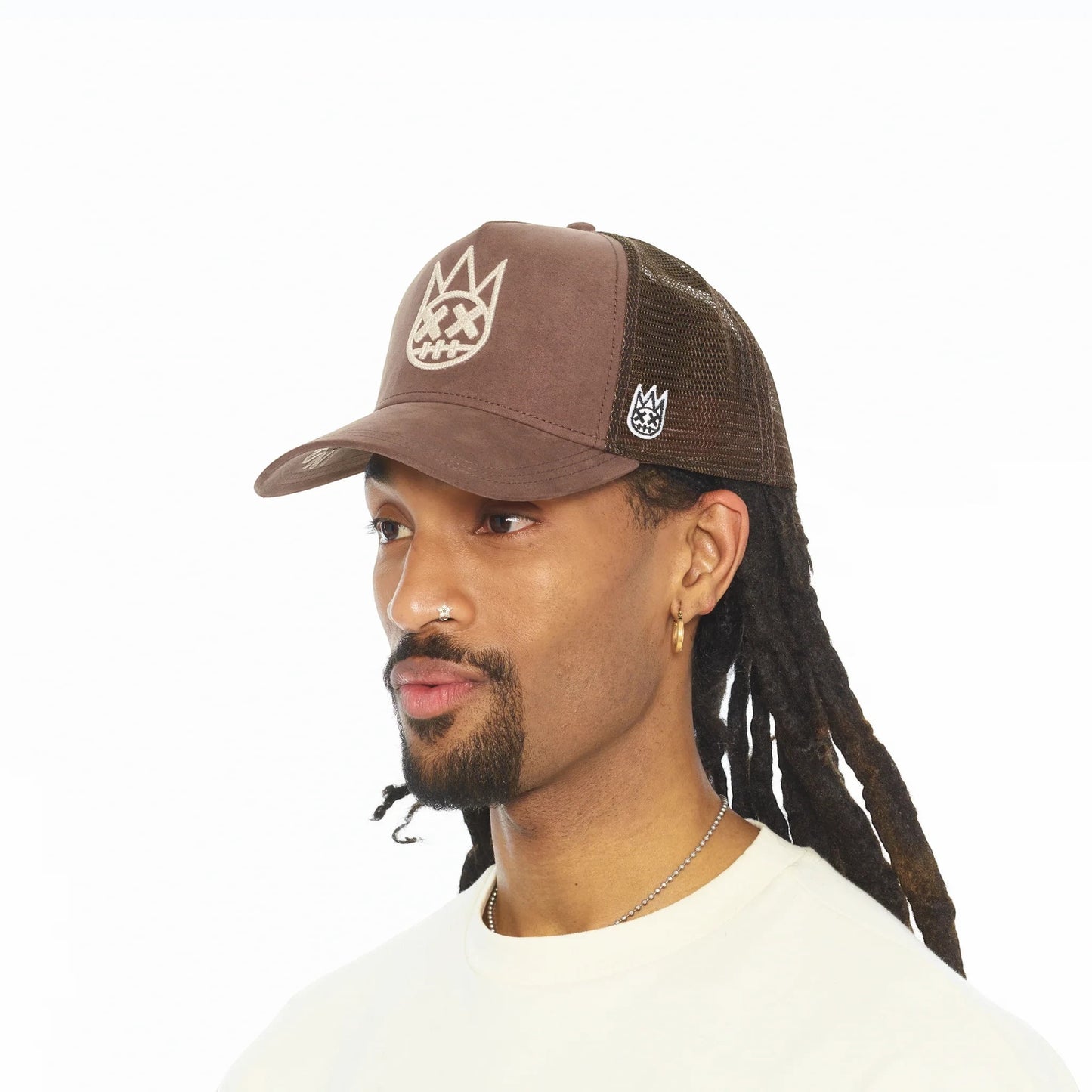Ballers Clothing Shop pinecone brown suede trucker hat with mesh back and raised chain-stitch logo on a model