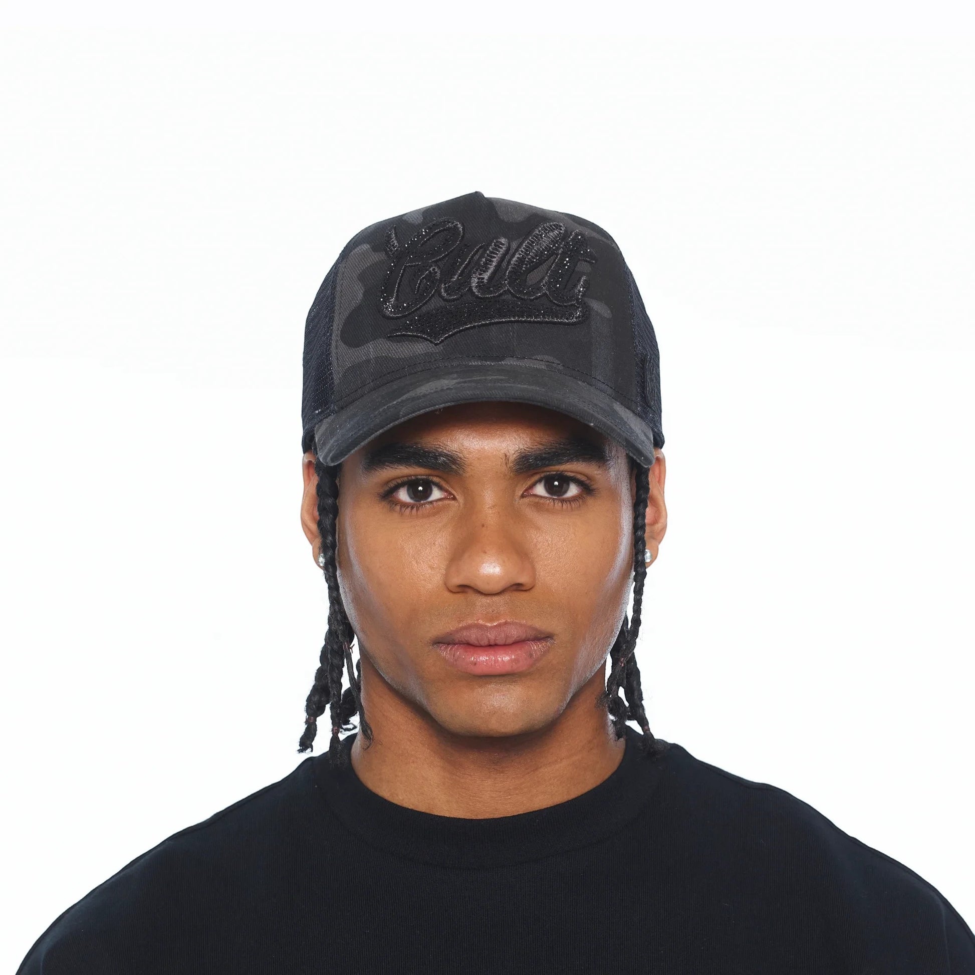 Ballers Clothing Shop camo mesh back trucker hat with black crystal script logo worn by a man