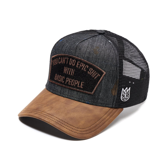 Ballers Clothing Shop black distressed denim trucker hat with brown brim and embroidered patch on white background.