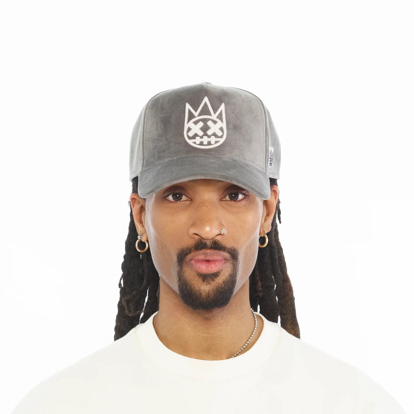 Ballers Clothing Shop grey velour A-frame trucker hat with raised white chain-stitch logo worn by a man