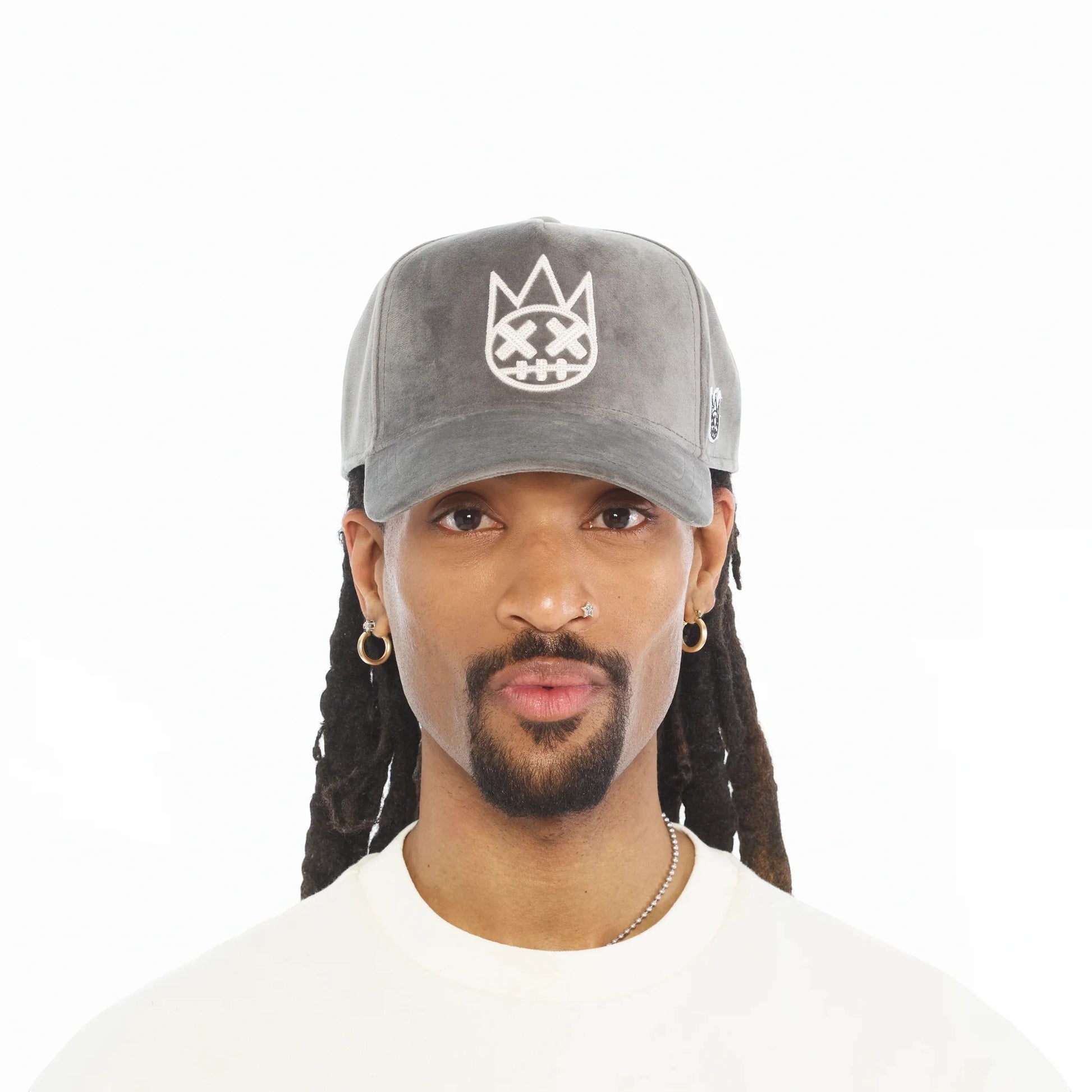Ballers Clothing Shop grey velour A-frame trucker hat with raised white chain-stitch logo worn by a man