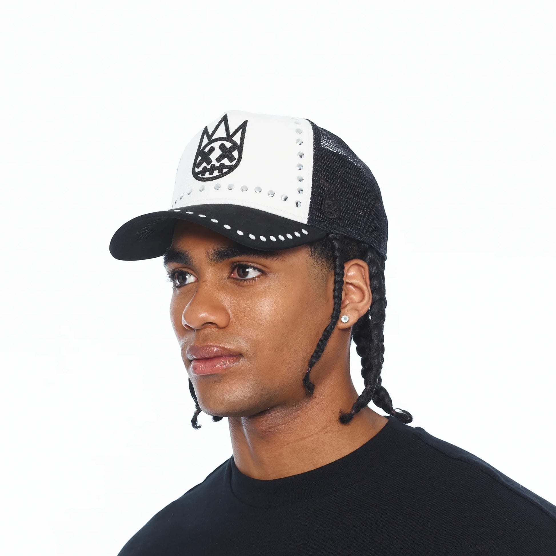 Ballers Clothing Shop black and white mesh trucker hat with embroidered logo and stud detailing on a male model