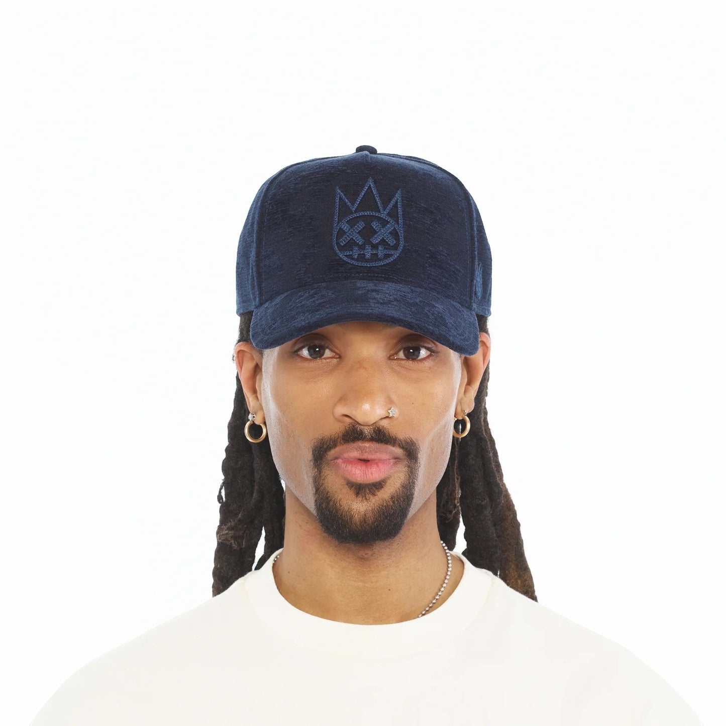 Ballers Clothing Shop navy jacquard trucker hat with raised chain-stitch Shimuchan logo worn by a man