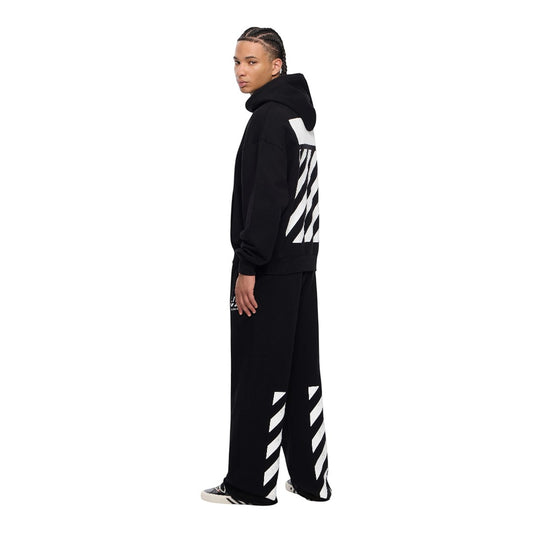 Ballers Clothing Shop model wearing black Off-White jogger pants and hoodie with signature white diagonal stripe print.