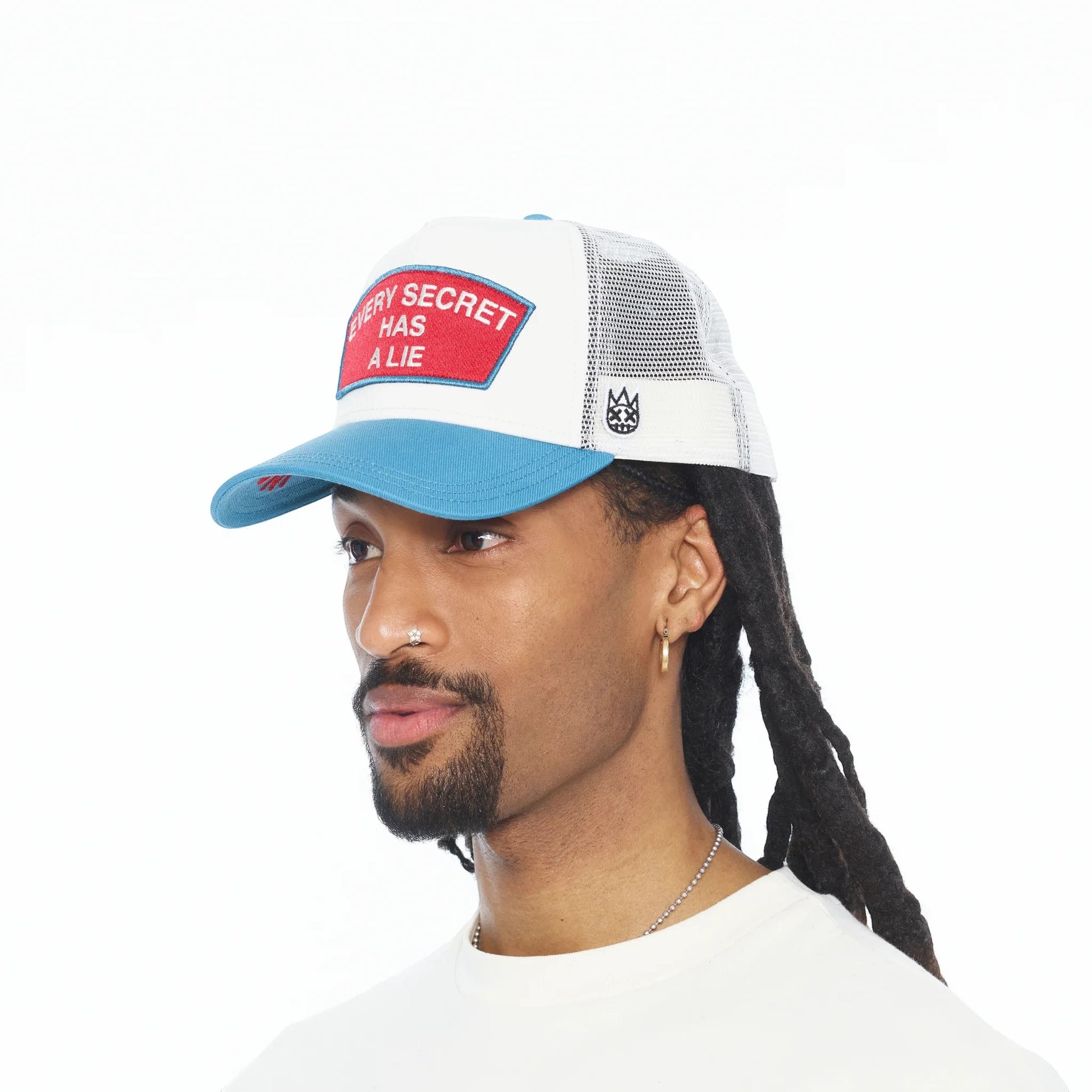 Ballers Clothing Shop trucker hat in white mesh with blue visor and Every Secret Has A Lie red embroidered patch