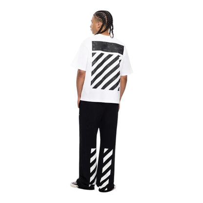 Model wearing Ballers Clothing Shop white oversized cotton t-shirt with black diagonal back print and matching pants