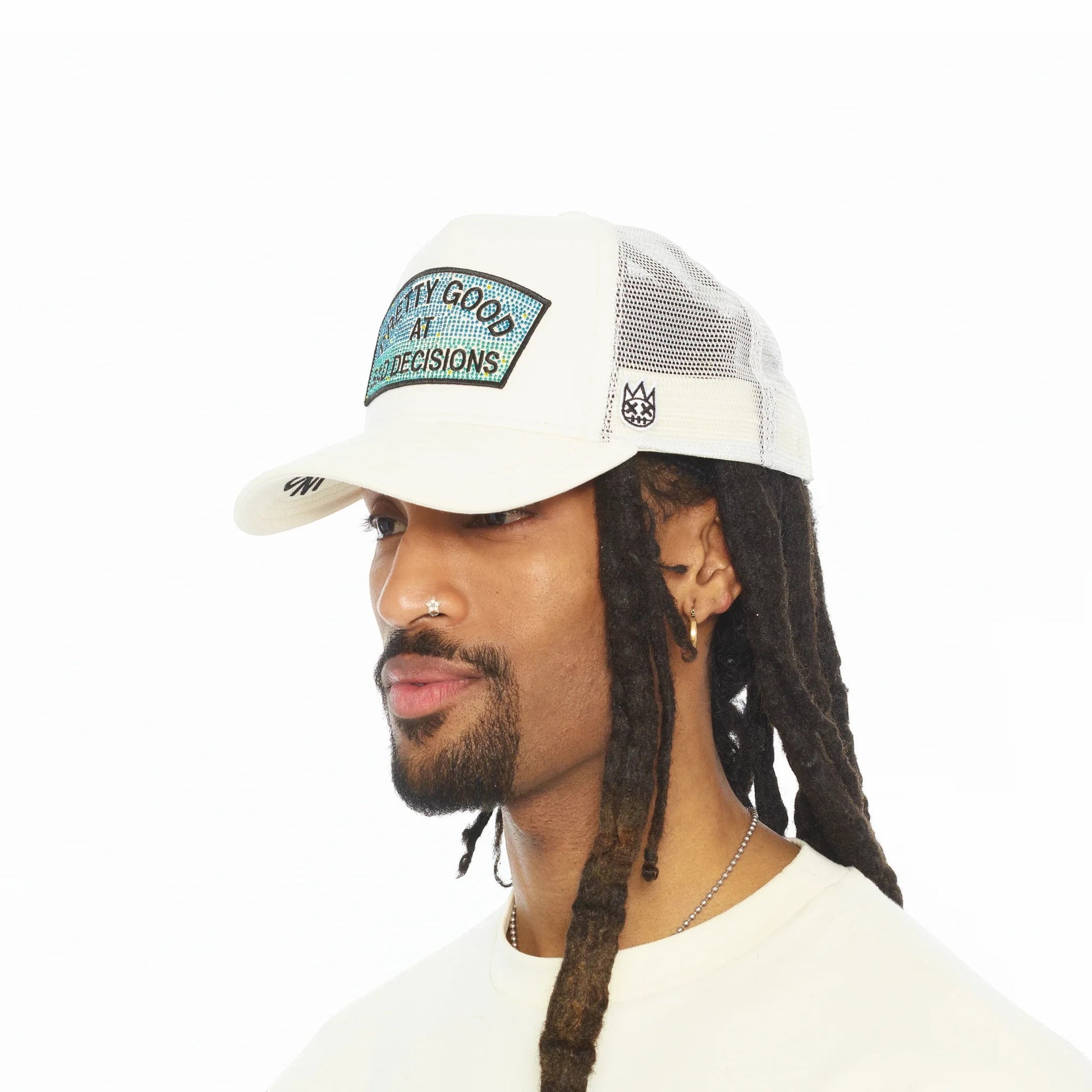 Ballers Clothing Shop white mesh back trucker hat with Pretty Good At Bad Decisions patch worn by a man with dreadlocks