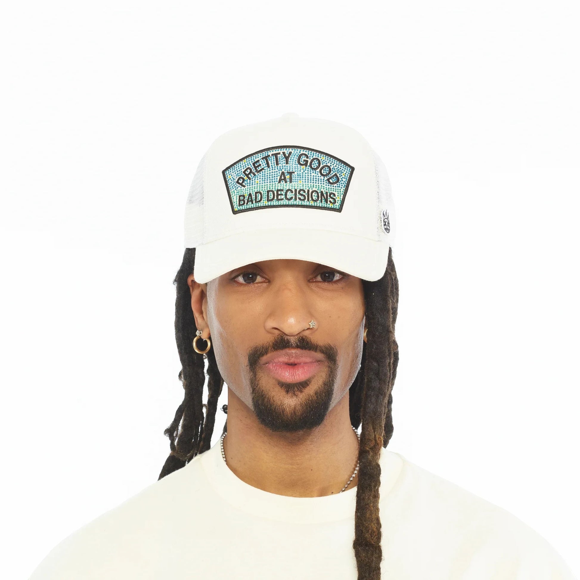 Ballers Clothing Shop white mesh back trucker hat with Pretty Good At Bad Decisions rhinestone patch on a model